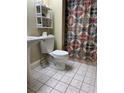 Clean bathroom with tiled floor and shower/tub at 128 121St Ave, Treasure Island, FL 33706