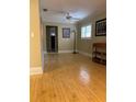 Light and airy living room featuring hardwood floors at 128 121St Ave, Treasure Island, FL 33706