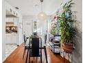 Cozy dining area with a glass table and hardwood floors at 2809 N 29Th St, Tampa, FL 33605