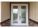 Double front doors with elegant glass inserts at 2972 Lake Saxon Dr, Land O Lakes, FL 34639