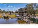 Aerial view of home on lakefront property with private dock at 3050 Maple Trce, Tarpon Springs, FL 34688