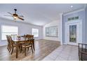 Bright dining room with wood flooring and large table at 3133 Beaver Pond Trl, Valrico, FL 33596