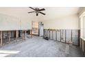 Under renovation, featuring exposed walls and flooring at 415 Country Club Dr, Oldsmar, FL 34677