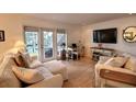 Bright living room with water views and comfortable seating at 5215 Coquina Key Se Dr # A, St Petersburg, FL 33705