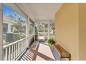 Relaxing screened porch with a bench and room for seating at 5320 Golden Isles Dr, Apollo Beach, FL 33572
