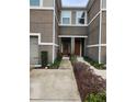 Townhome entrance with double doors and walkway at 5508 Viola Lee Way, Lutz, FL 33558