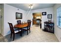 Bright dining room with wood table and chairs, kitchen partially visible at 6100 Gulfport S Blvd # 214, Gulfport, FL 33707