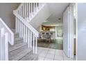 Clean and bright staircase leading to the upper level of the home at 6781 121St Ave # F, Largo, FL 33773