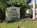 Community entrance sign for Villas Capri, a 55+ community at 12200 Vonn Rd # 1201, Largo, FL 33774