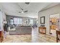 Spacious living room with sectional sofa and fireplace at 15521 Long Cypress Dr, Ruskin, FL 33573