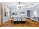 Spacious dining area with hardwood floors and modern light fixture at 20000 Outpost Pt Dr, Tampa, FL 33647