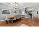 Bright dining room with hardwood floors, large windows and staircase at 20000 Outpost Pt Dr, Tampa, FL 33647