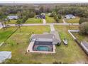 Aerial view showing a house, pool, and expansive backyard at 25555 Oaks Blvd, Land O Lakes, FL 34639