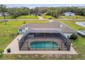 Enclosed pool area with a spacious screened enclosure at 25555 Oaks Blvd, Land O Lakes, FL 34639