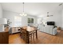 Dining area with wooden table and chairs, adjacent to living room at 7001 Interbay Blvd # 313, Tampa, FL 33616