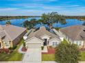 One-story house with solar panels, overlooking a lake at 12645 Flatwood Creek Dr, Gibsonton, FL 33534