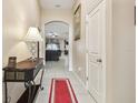 Bright entry hall with view to living room at 12645 Flatwood Creek Dr, Gibsonton, FL 33534