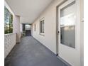 Clean and well-lit hallway with access to condo units at 1524 Lakeview Rd # 305, Clearwater, FL 33756