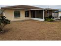 Home features a screened porch and a spacious backyard at 237 Orduna Dr, North Port, FL 34287