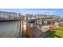 Private boat dock with wooden deck and lift, perfect for waterfront living at 5146 Beach Se Dr # F, St Petersburg, FL 33705