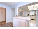 Kitchen features white cabinets, and appliances at 5555 Gulf Blvd # 209, St Pete Beach, FL 33706