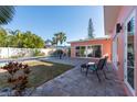 Inviting backyard oasis featuring a refreshing pool and patio area at 5611 8Th N Ave, St Petersburg, FL 33710