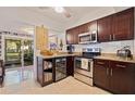 Modern kitchen with stainless steel appliances and dark wood cabinetry at 5719 23Rd S Ave, Gulfport, FL 33707