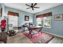 Spacious home office with hardwood floors and large windows at 10527 Falling Leaf Ct, Parrish, FL 34219