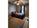 Well-lit bedroom with carpeted floors and a ceiling fan at 1102 Lake Highview Ln, Brandon, FL 33510