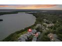 Aerial view of waterfront condo community with pool and lush landscaping at 1111 N Bayshore Blvd # F6, Clearwater, FL 33759