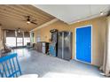 Covered patio with game area and additional seating at 1230 32Nd N St, St Petersburg, FL 33713