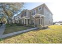 Green townhome exterior with a walkway and landscaping at 12334 Healey Summit Ln # 12334, Riverview, FL 33579