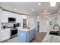 Modern kitchen with stainless steel appliances and island at 2250 Rio De Janeiro Ave, Punta Gorda, FL 33983