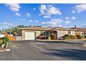 Charming single-story home with a carport and landscaped yard at 4235 Moody St, St Pete Beach, FL 33706