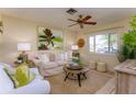 Cozy living room featuring a comfortable sofa and a ceiling fan at 6262 109Th N Ter, Pinellas Park, FL 33782