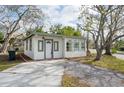 Charming bungalow with a newly paved driveway and well-maintained landscaping at 6699 78Th N Ave, Pinellas Park, FL 33781