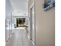 View down a hallway showing access to the kitchen and backyard at 6944 Towne Lake Rd, Riverview, FL 33578