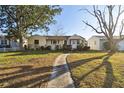 House exterior view showcasing the front yard and walkway at 718 40Th Ne Ave, St Petersburg, FL 33703