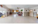 Kitchen and living area with partially completed renovations and tiled floors at 7824 3Rd S Ave, St Petersburg, FL 33707