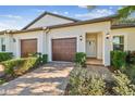 Two-unit home with two-car garages and landscaping at 10374 Echo Dock Loop, San Antonio, FL 33576