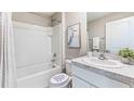 Clean bathroom with a shower/tub combo and white vanity at 10551 Dusty Boot Rd, Land O Lakes, FL 34638