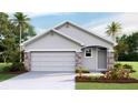 Two-story house with stone accents and a two-car garage at 10551 Dusty Boot Rd, Land O Lakes, FL 34638