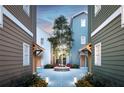Private courtyard with trees and pathway between townhouses at 2550 1St N Ave, St Petersburg, FL 33713