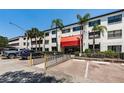 Condo building exterior with landscaping and parking at 2587 Countryside Blvd # 6303, Clearwater, FL 33761