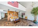 Condo lobby with comfortable seating and wood accent wall at 2587 Countryside Blvd # 6303, Clearwater, FL 33761