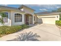 Well-maintained house with a two-car garage and landscaped front yard at 3019 124Th E Ave, Parrish, FL 34219