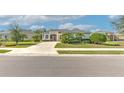 House situated on a quiet street with a manicured lawn at 3019 124Th E Ave, Parrish, FL 34219