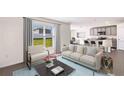 Open living area with light-colored sofa and access to kitchen at 33182 Osprey Peak Way, San Antonio, FL 33576