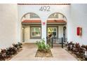 Condo entry with arched entryway and private patio at 492 Santa Cruz Ne Pl # D, St Petersburg, FL 33703