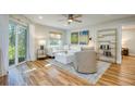 Bright living room with hardwood floors and comfy furniture at 492 Santa Cruz Ne Pl # D, St Petersburg, FL 33703